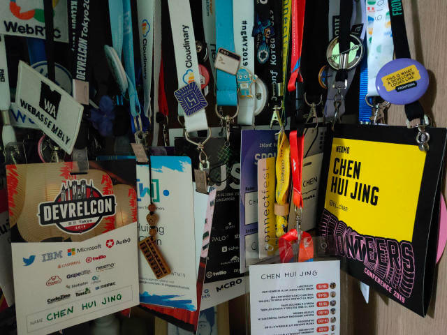 Conference badges hanging in my closet